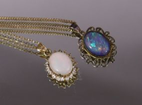 A black opal oval pendant on yellow metal chain necklace marked “375” (the chain 2.2gm); and another