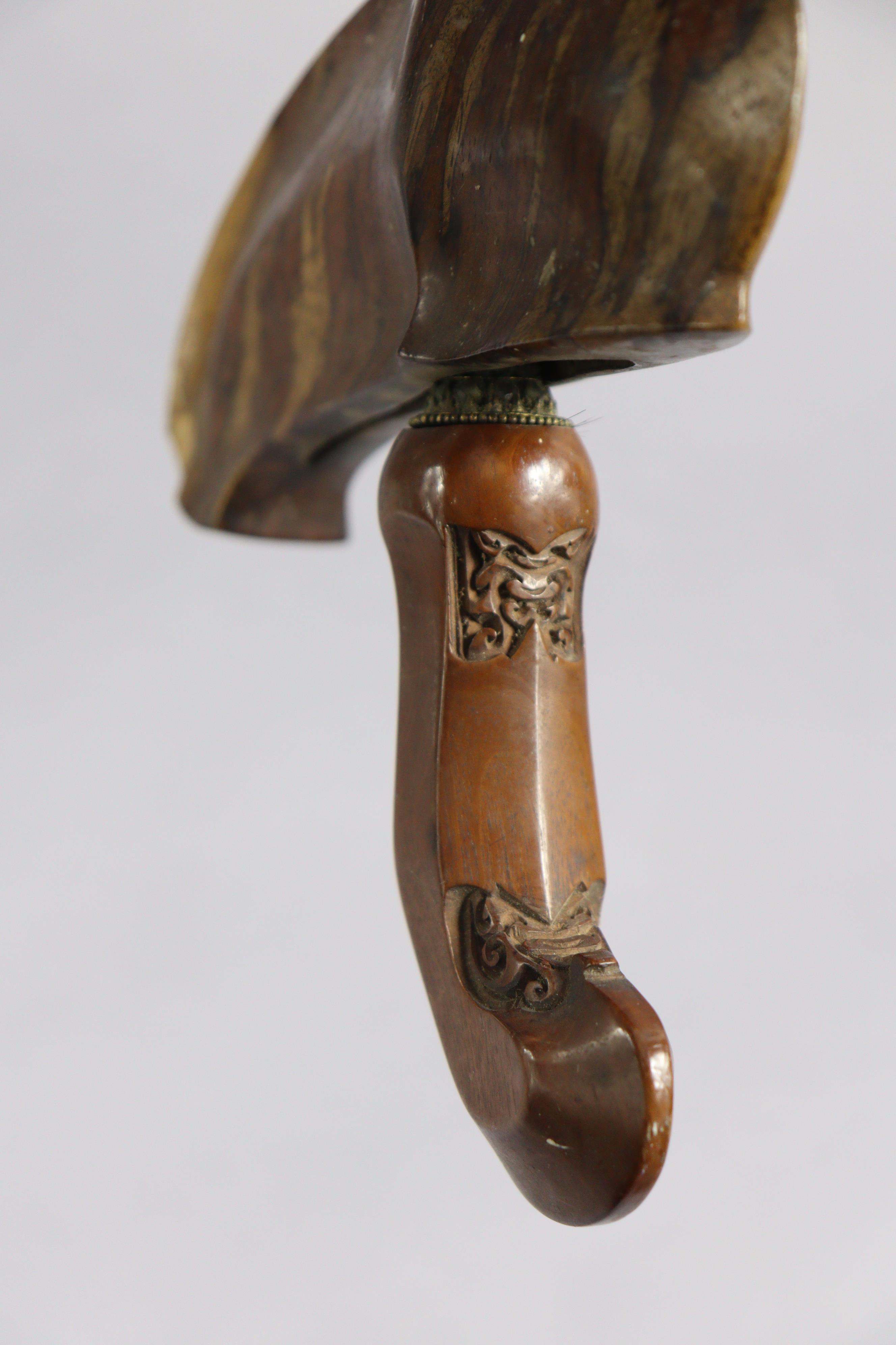An Indonesian Kris having a 33.5cm long wavy blade, carved wooden grip, & with a metal-covered - Image 4 of 7