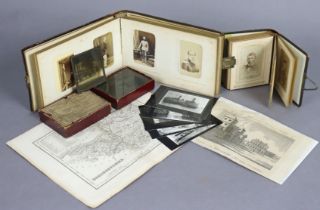 A vintage family photograph album containing sixty portrait studies, & in a carved wooden binding;