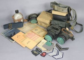 Three vintage respirators, boxed, various military cloth badges, various home office booklets, etc.