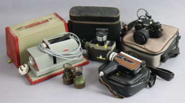 A Minolta “X-300” camera with various accessories; two cine cameras; a slide projector; & a pair