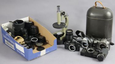 A 1970s Russian monocular field microscope, with case, & various cameras & accessories.