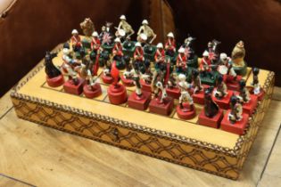 A part-set of painted lead chessmen modelled as British & Indian soldiers, each on wooden base, 5cm