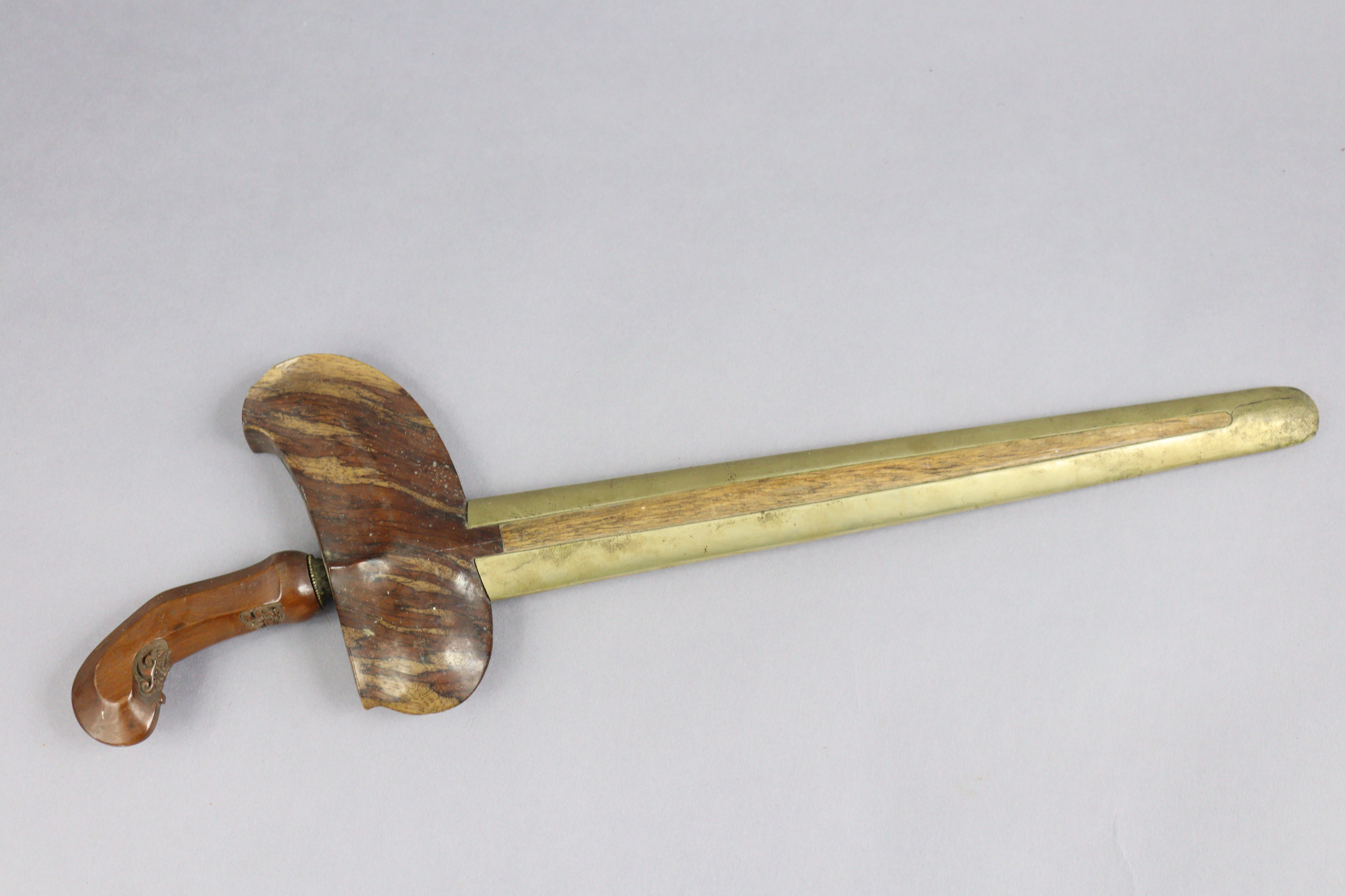 An Indonesian Kris having a 33.5cm long wavy blade, carved wooden grip, & with a metal-covered - Image 2 of 7