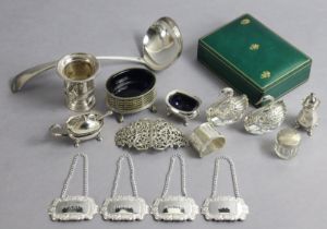 A set of four silver plated decanter labels, three silver plated condiments, a silver plated
