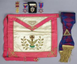 A Masonic regalia apron, sash, & five medals.