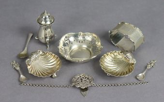 A pair of silver shell design salt cellars, 5.5cm wide (different hallmarks), a silver napkin ring