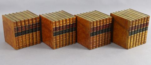 A set of four faux-book storage boxes, each in the form of seven leather-bound books, 15cm wide x