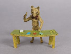An Austrian cold-painted novelty ornament in the form of a standing fox playing cards on a table (