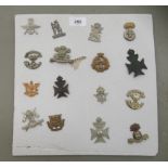 Sixteen regimental cap badges and other insignia, some copies: to include 10th Royal Hussars, East