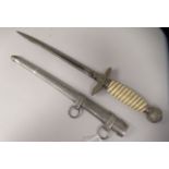A German military dress dagger with swastika emblem on the pommel and hilt and a woven wire bound