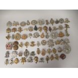 Approx. sixty regimental cap badges and other insignia, some copies: to include Northamptonshire,