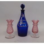 A Bristol blue glass decanter and medallion stopper, inscribed in gilt 'Rum' on a chained label  8"
