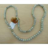 A Chinese jade graduated bead necklace  37"L
