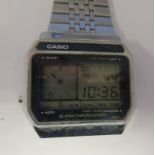 A Casio Alarm Chronograph stainless steel cased bracelet watch, faced by a digital dial