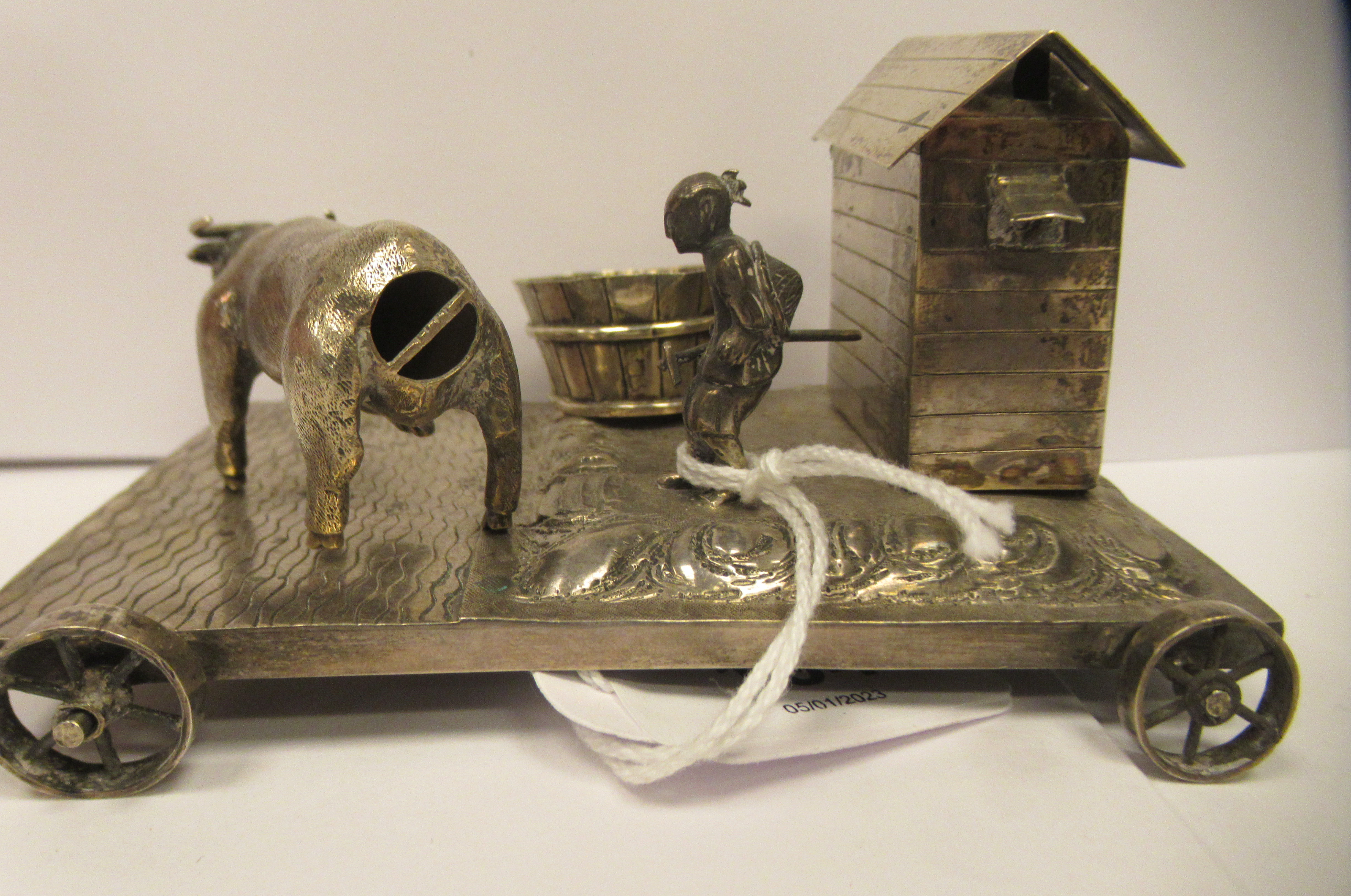 A Chinese silver coloured metal miniature novelty stand, the rectangular platform on four spoked - Image 4 of 6