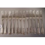 A matched set of twelve Victorian silver fiddle pattern table forks  mixed London marks
