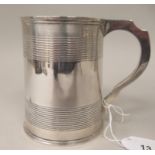 A Victorian silver one pint mug of tapered, cylindrical form with grooved horizontal bands, on