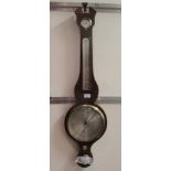 A Regency mahogany wheel barometer with a thermometer and a silvered dial  38"h