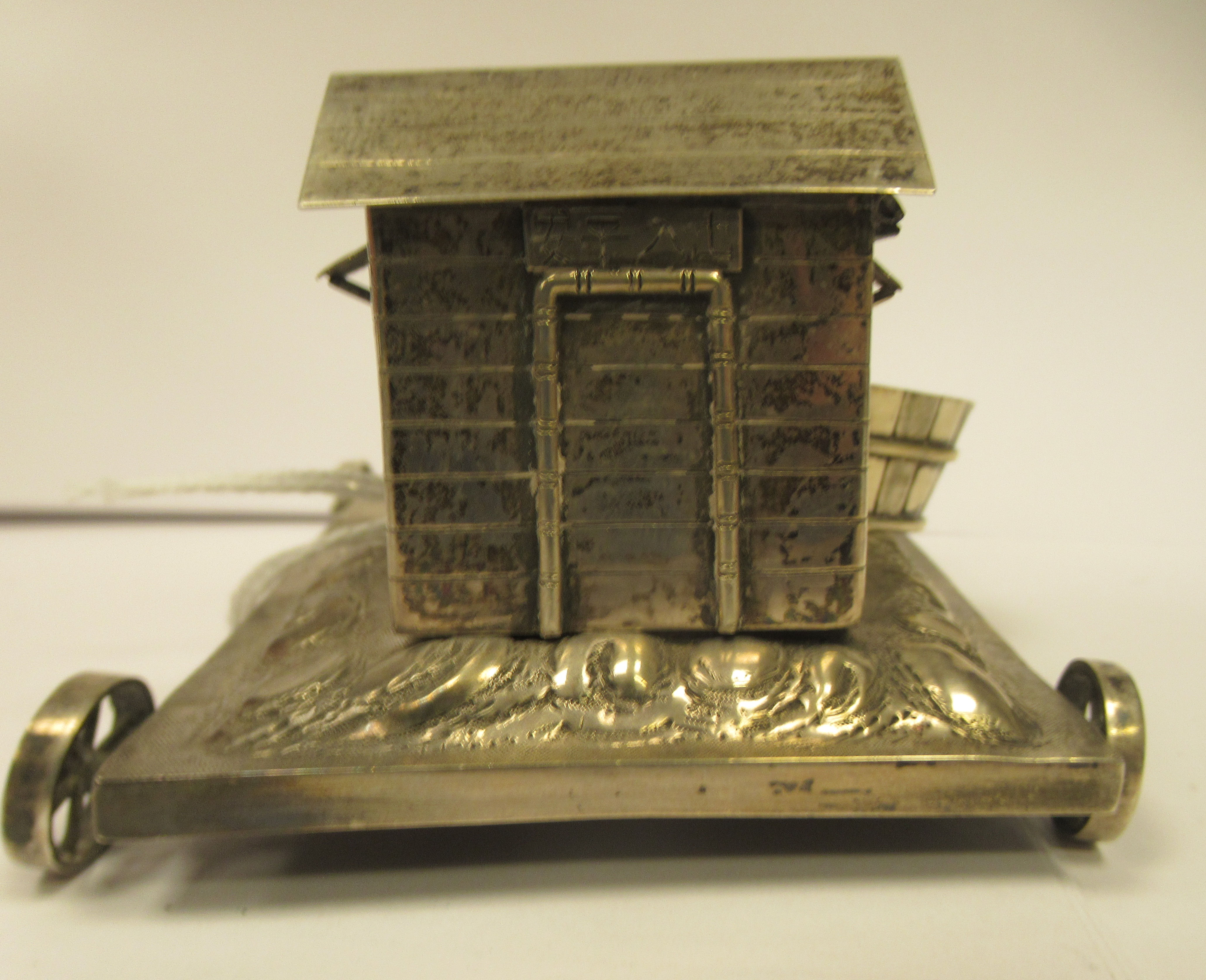 A Chinese silver coloured metal miniature novelty stand, the rectangular platform on four spoked - Image 3 of 6