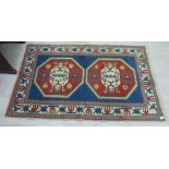 A Turkish Kazakh rug, decorated with two octagonal medallions, on a multi-coloured ground  51" x 79"