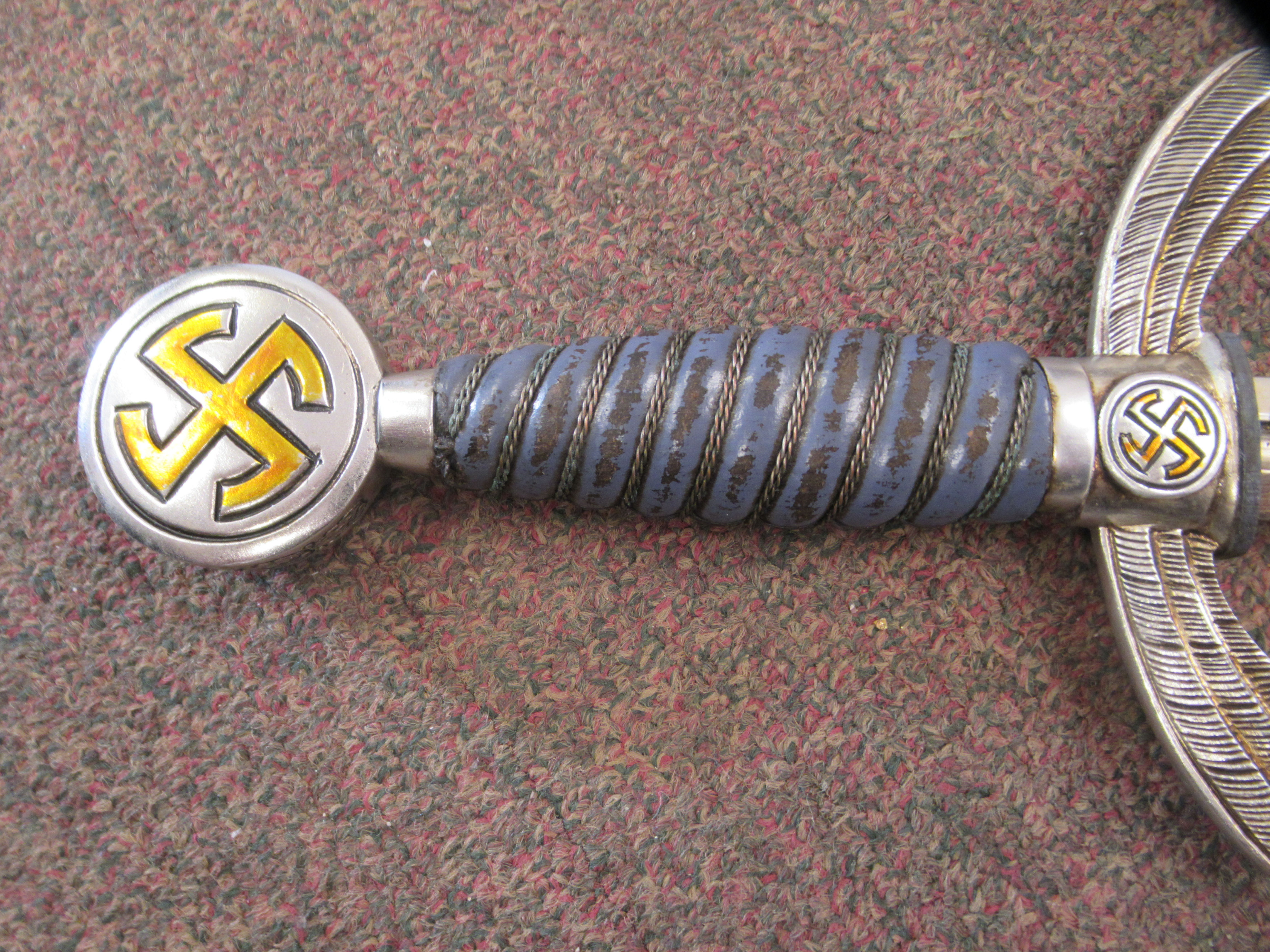A German Luftwaffe dress sword with swastika emblems on the pommel and hilt, a woven wire bound - Image 6 of 7
