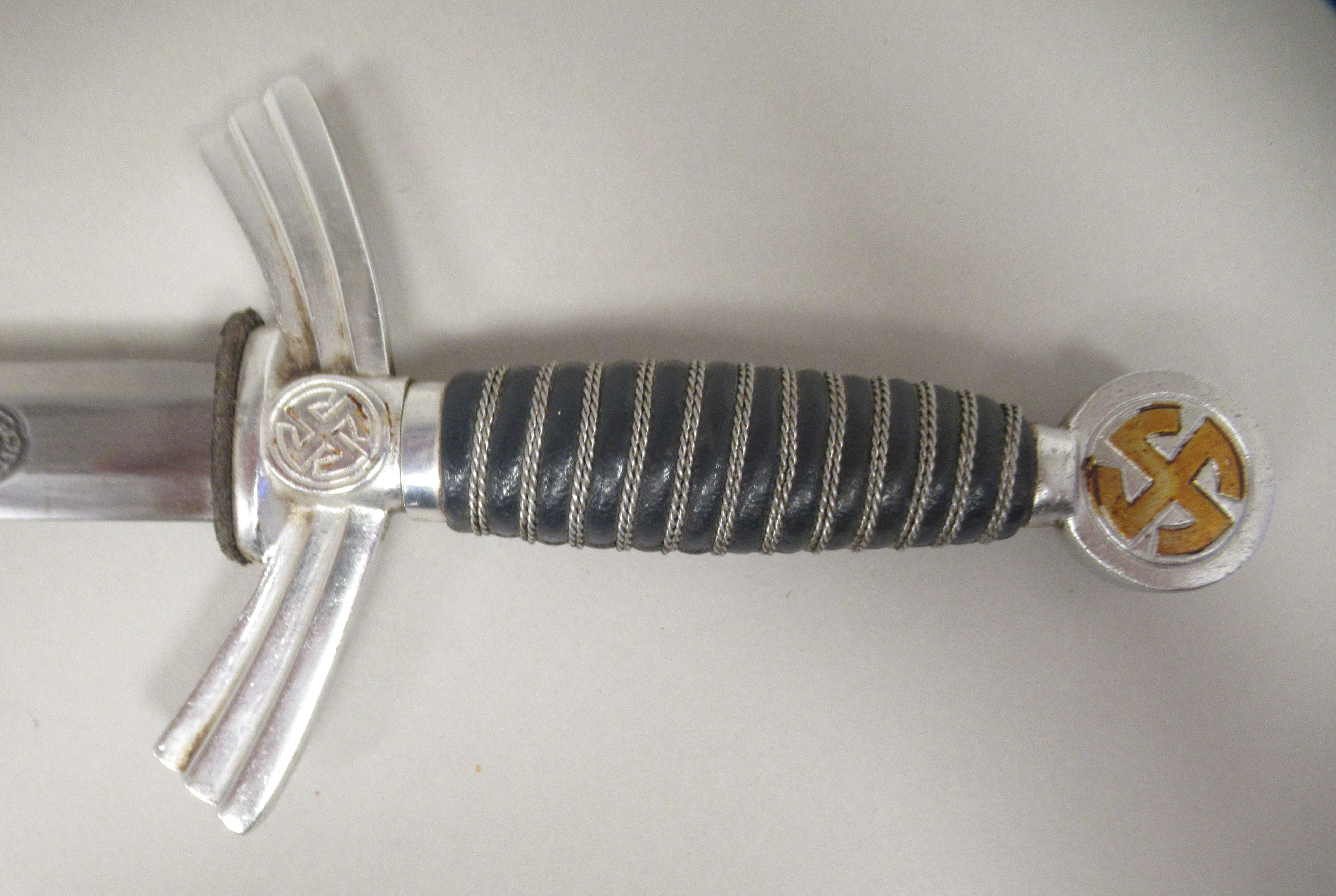 A German SS dress dagger with swastika emblems on the pommel and hilt and a woven wire band - Image 3 of 7
