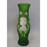An early 20thC opaque green glass vase of waisted baluster form, decorated in green coloured