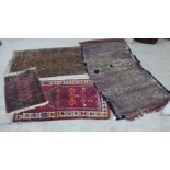 Four various rugs: to include a Bokhara, on a red ground  25" x 35"