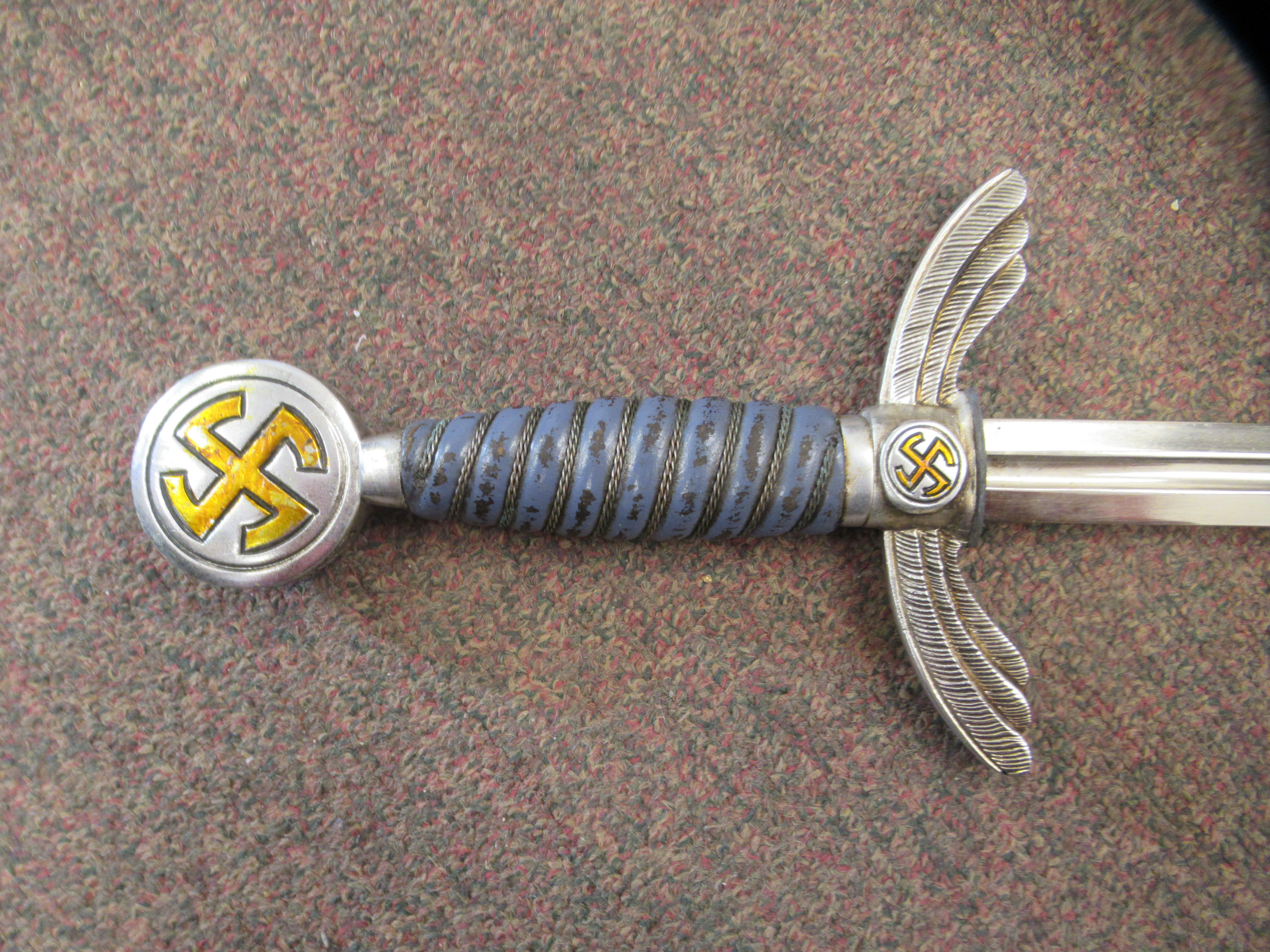 A German Luftwaffe dress sword with swastika emblems on the pommel and hilt, a woven wire bound - Image 2 of 7