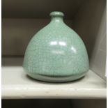 A 20thC Chinese Song style crackle glazed pottery vase with a narrow neck and bell shaped body  4.