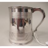 A Georgian silver 1pt mug of tapered cylindrical form with grooved horizontal bands, on applied wire