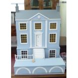 A modern Georgian design blue and white painted doll's house with a double opening front,