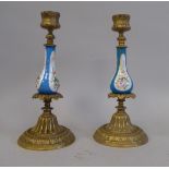 A pair of early 20thC Continental decoratively cast gilt metal and floral painted porcelain