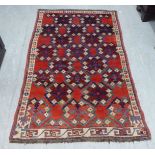 A North African design rug, decorated with repeating formations, on a multi-coloured ground  48" x