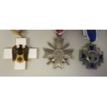 Two German military neck awards on ribbons, viz. a Maltese Cross with curved sword 1939; and another