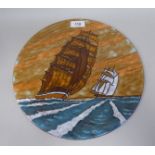 A Poole pottery platter, decorated by L Elsden with galleons under sail  12"dia