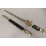 A German hunting dagger with swastika emblems on the handgrip and hilt, the engraved 12"L blade,