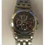 A Seiko stainless steel cased bracelet chronograph, faced by a Roman dial with sweeping seconds,