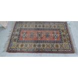 A Turkish Milas rug, decorated with geometric designs, on a multi-coloured ground  49" x 80"