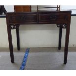 A late 19thC Chinese rosewood altar design side table with two drawers, over carved brackets, raised