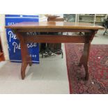 A late Victorian Gothic inspired mahogany hall table, raised on planted ends  30"h  42"w