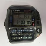 A Casio Wrist Remote Controller Alarm Chrono and Calculator wristwatch, faced by a digital dial