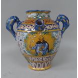 An Italian 18th/19thC style maiolica earthenware twin handled, baluster shape drug jar with a spout,