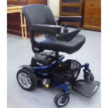 A Reno Elite battery powered electric wheelchair with a charger