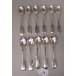 A matched set of eleven Victorian silver fiddle pattern teaspoons  mixed London marks