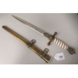 A German Navy dress dagger with a swastika and eagle pommel and a wire bound handgrip, the