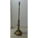 A late Victorian brass standard lamp, raised on splayed feet  46"h