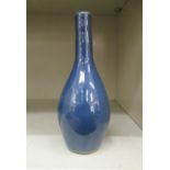 An 18th/19thC Chinese monochrome blue glazed bottle vase of bulbous form with a narrow neck  7.5"h