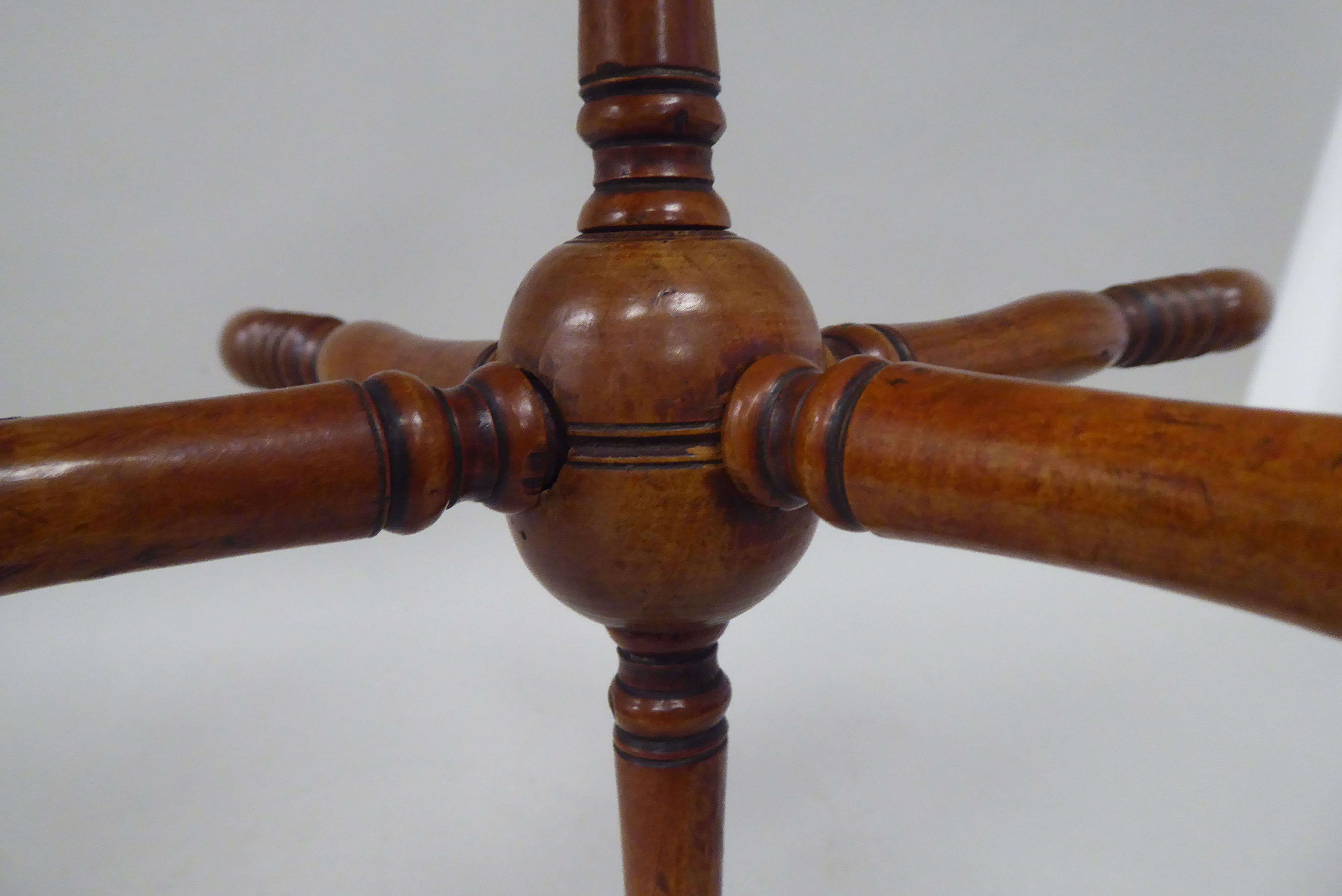 A late 19thC fruitwood wool winder, comprising six ring turned spindles, threaded to the central - Image 3 of 3